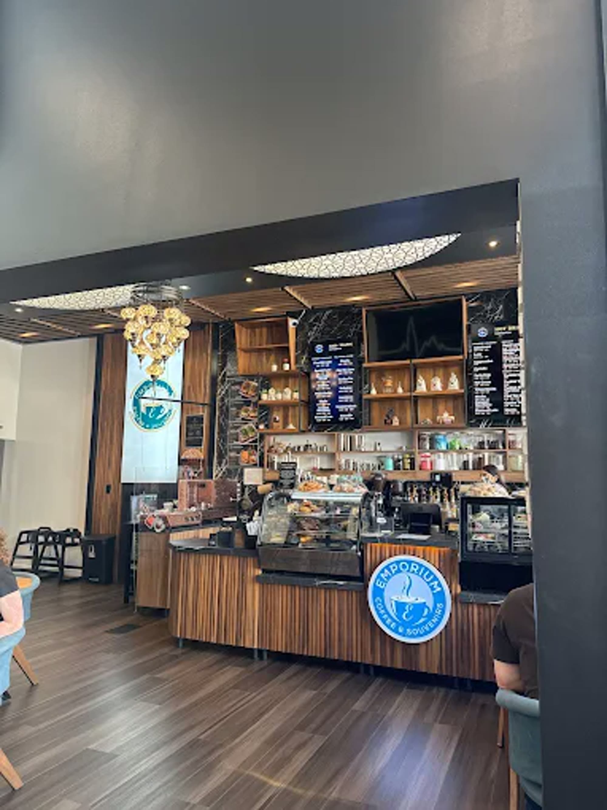 Espresso bar counter with pastry case and menu boards