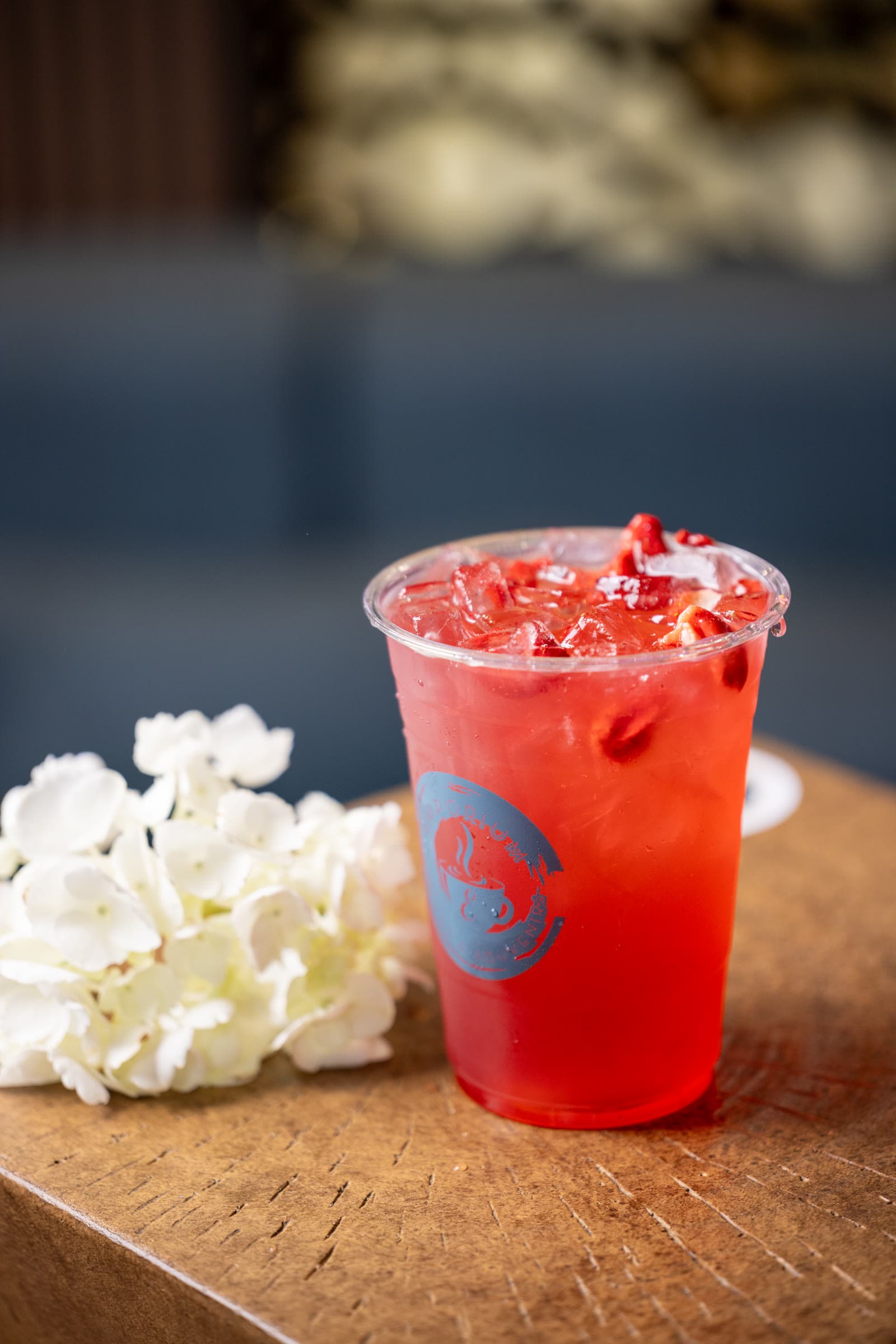 Iced strawberry refresher in a branded Emporium cup